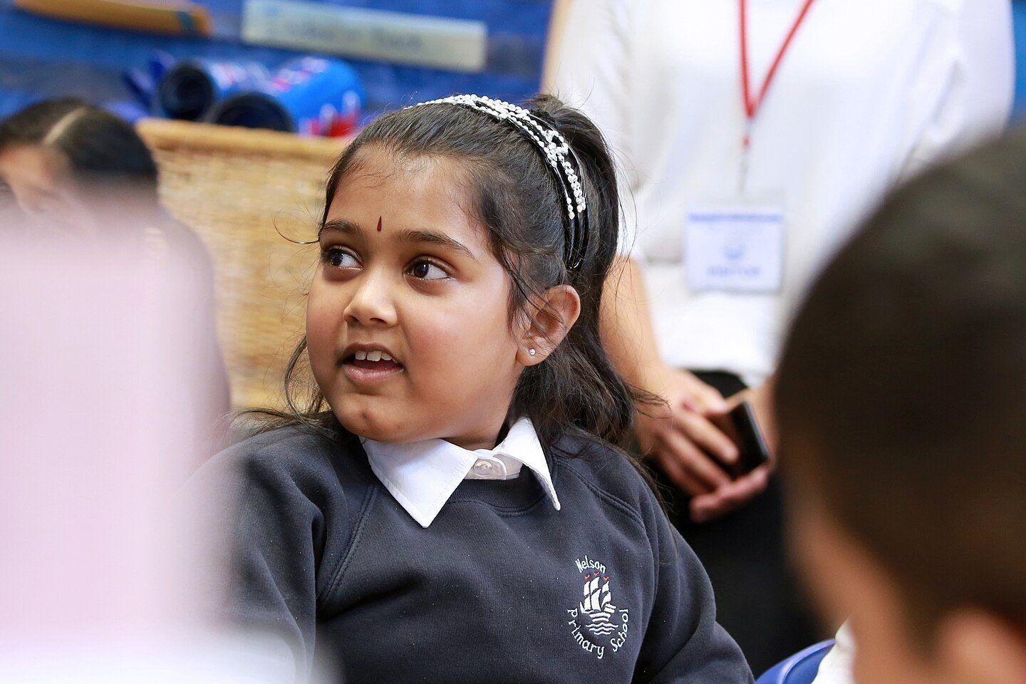 A pupil listening in class
